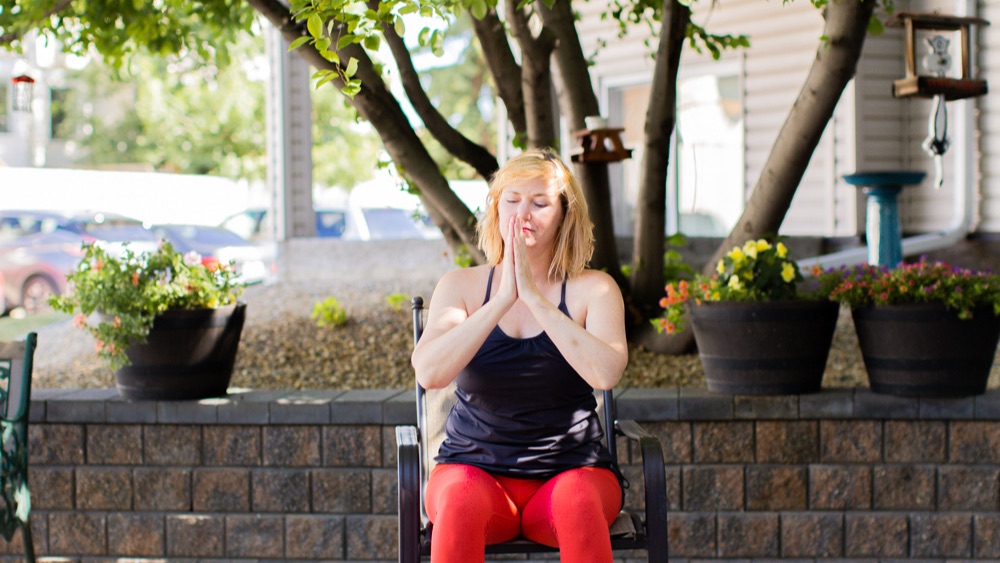 A lady doing chair exercises for seniors