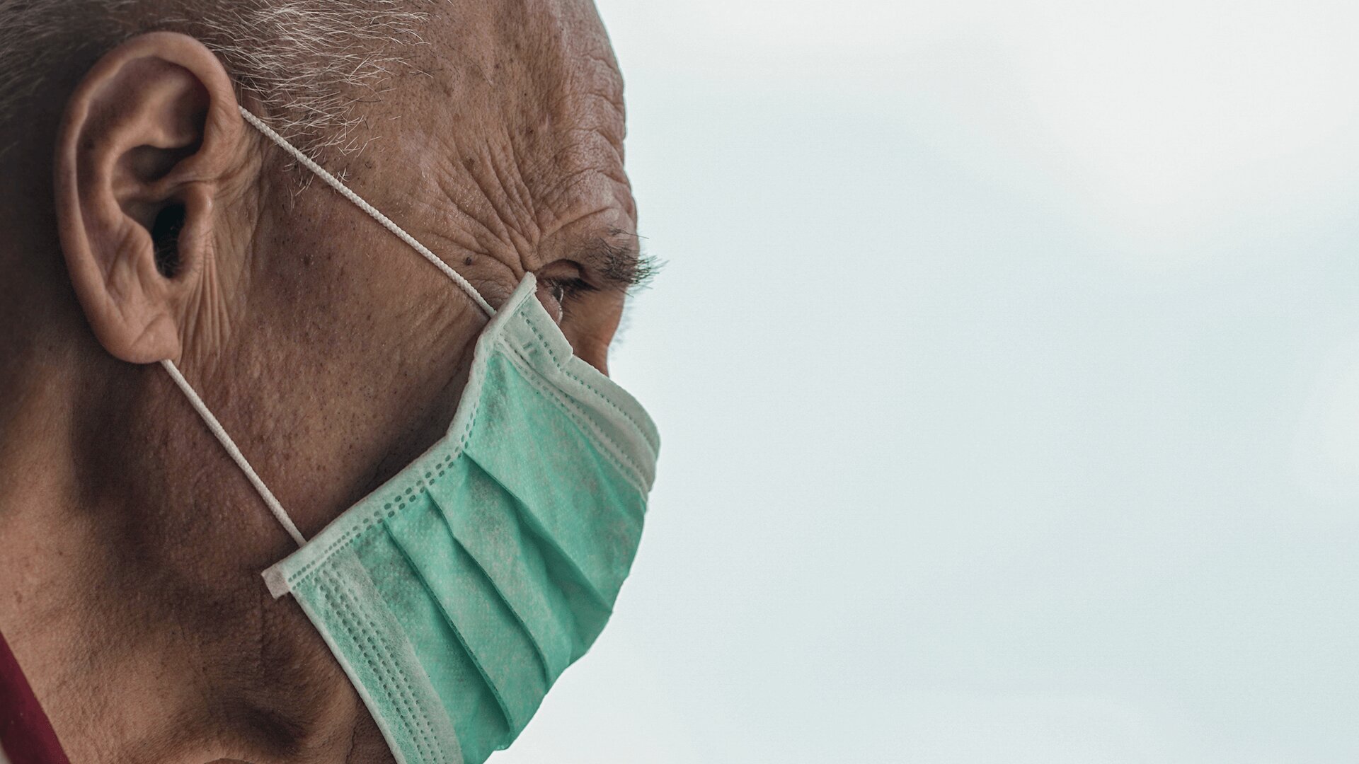 An elder man wearing mask during COVID-19 in  senior homes