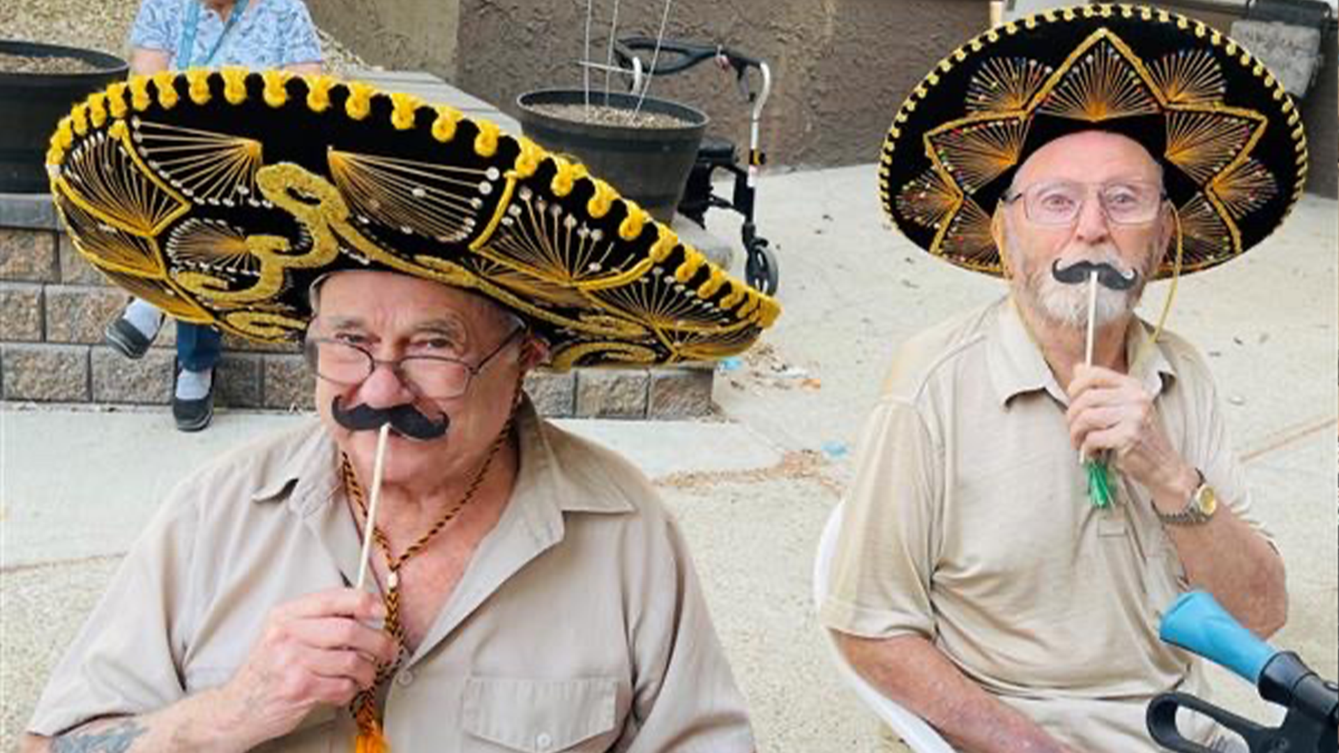 Two senior men posing in sombrero's