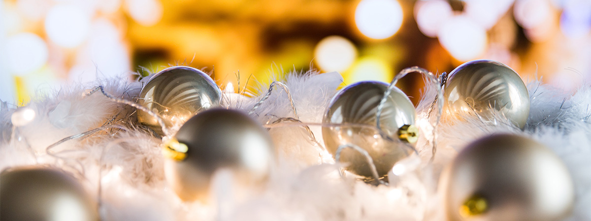 Christmas ornaments interwoven with lights and a wreath in affordable senior housing