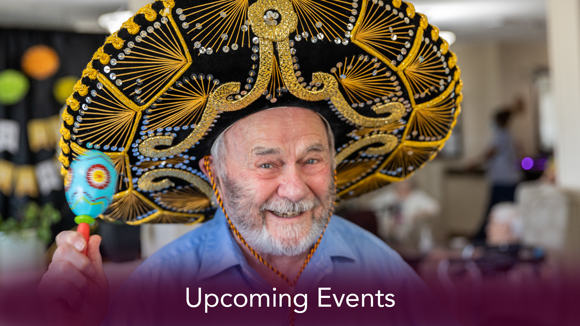 man in a sombrero with a maraca in a senior living community