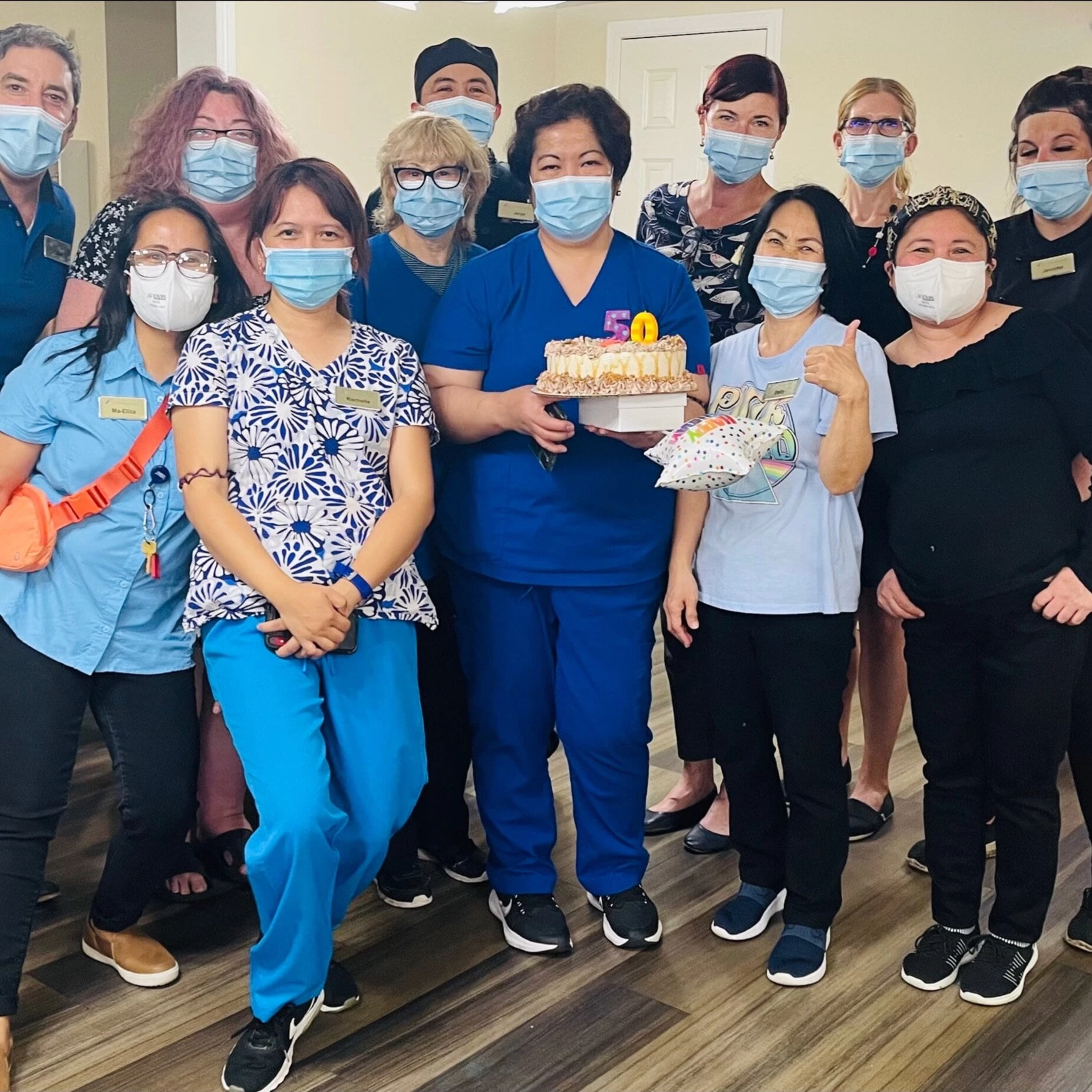 A celebration of staff member's 50th birthday party in independent living for seniors