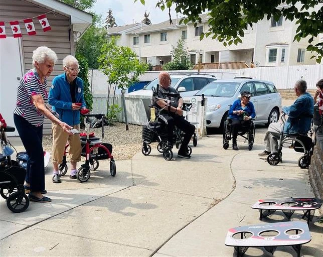 Seniors enjoying some cornhole outside