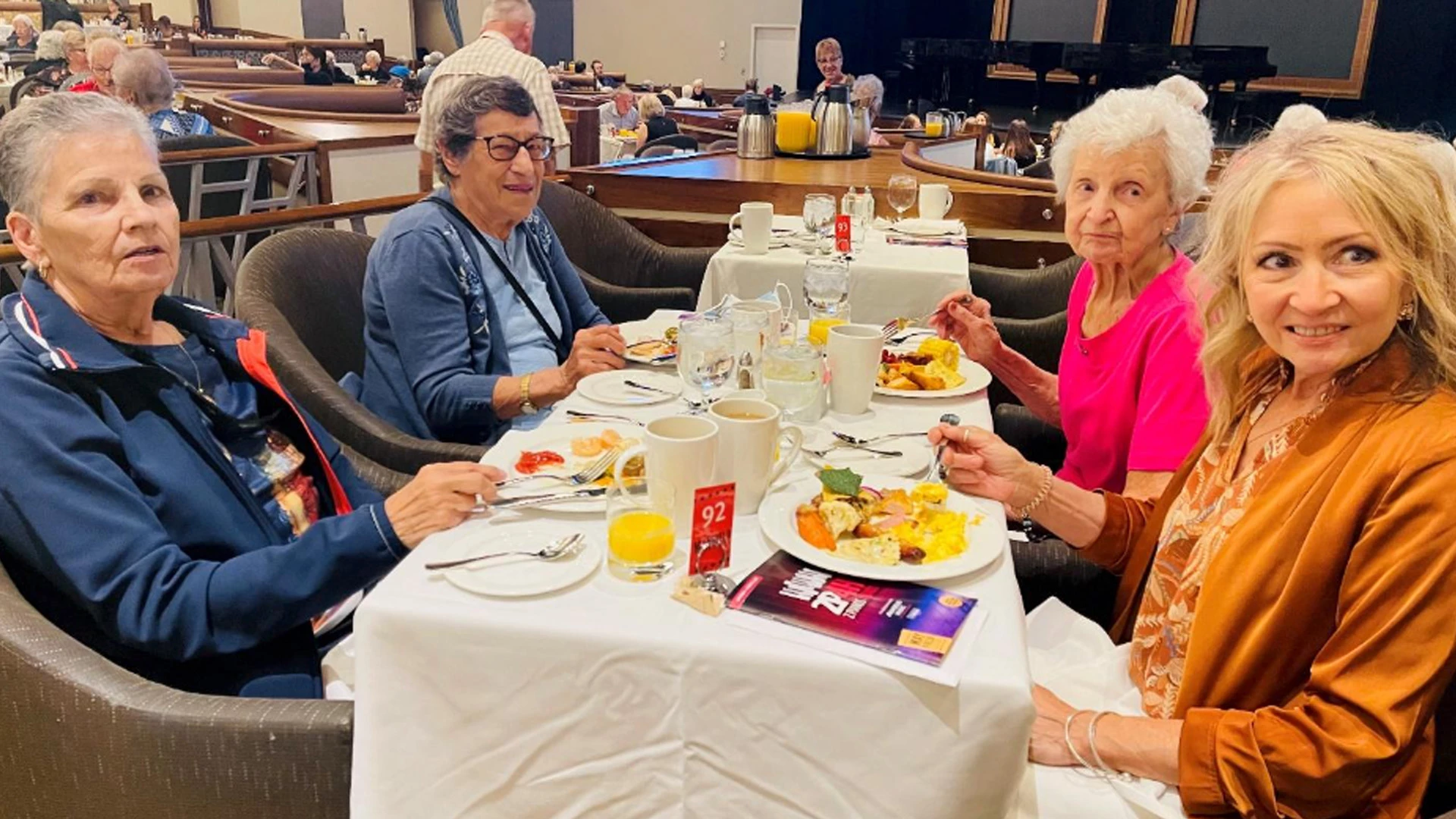 A gathering of senior woman having breakfast