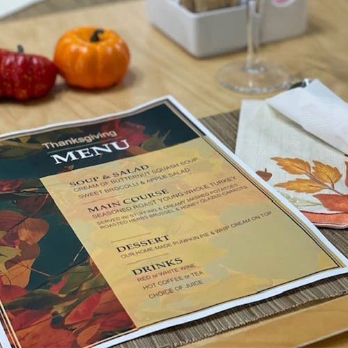 Thanksgiving menu featuring a starter soup & salad, a main course, a dessert, and drinks.