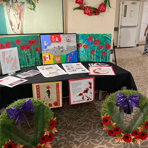 Remembrance Day display with wreaths and art.